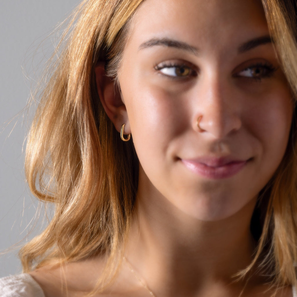 a close up of a person wearing a necklace
