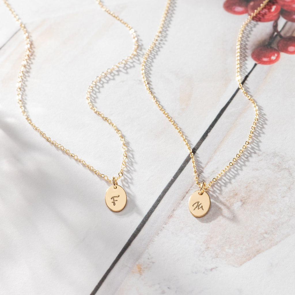 a couple of necklaces sitting on top of a table