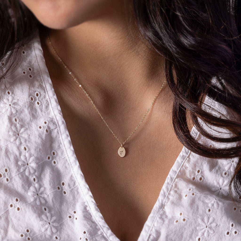 a close up of a person wearing a necklace