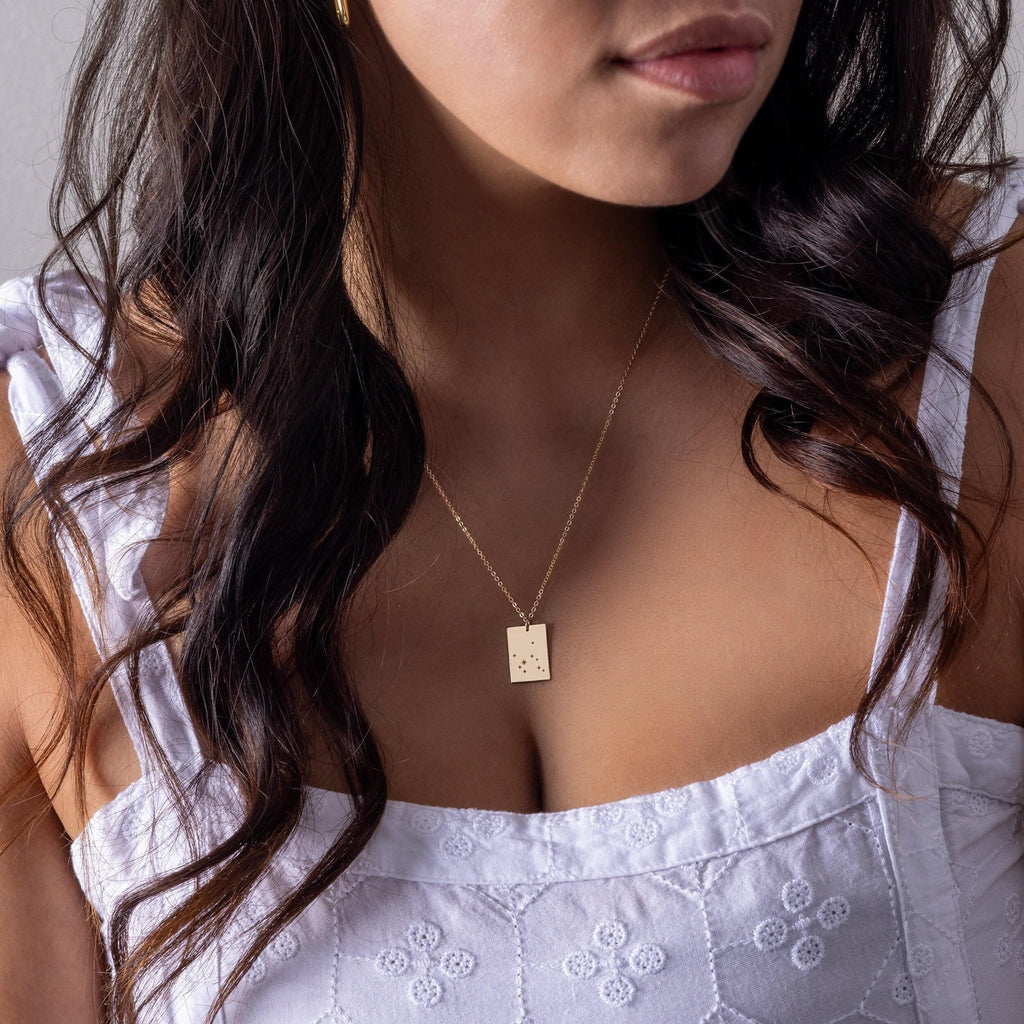 a close up of a person wearing a necklace