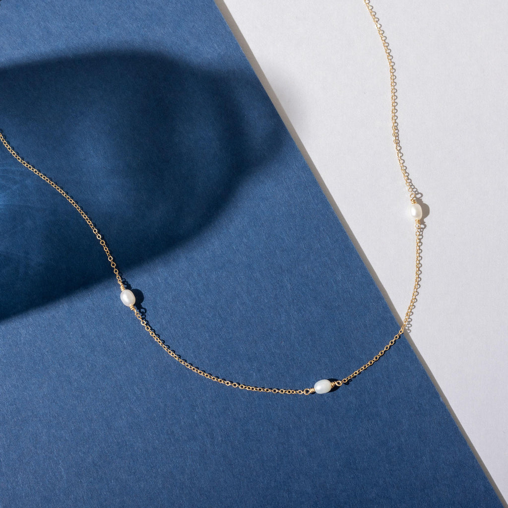 a close up of a necklace on a table