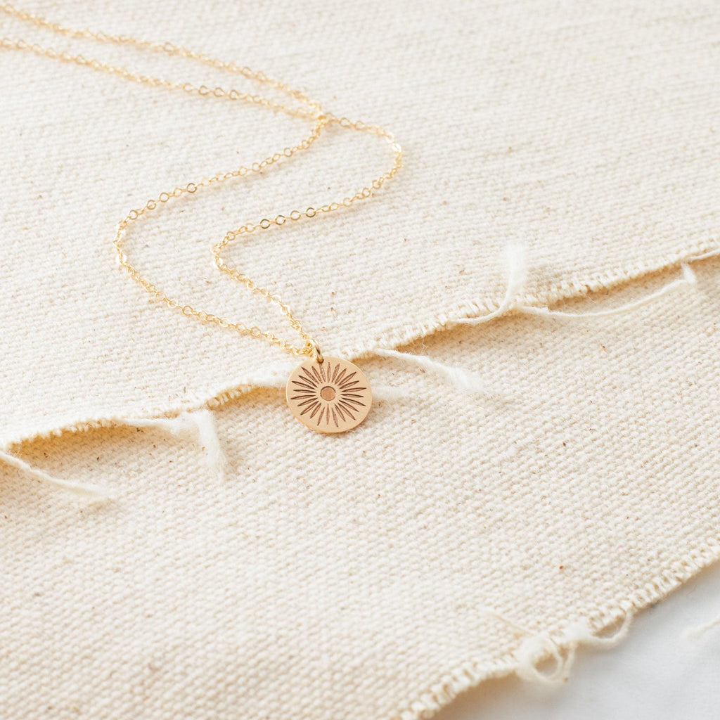 a close up of a necklace on a cloth