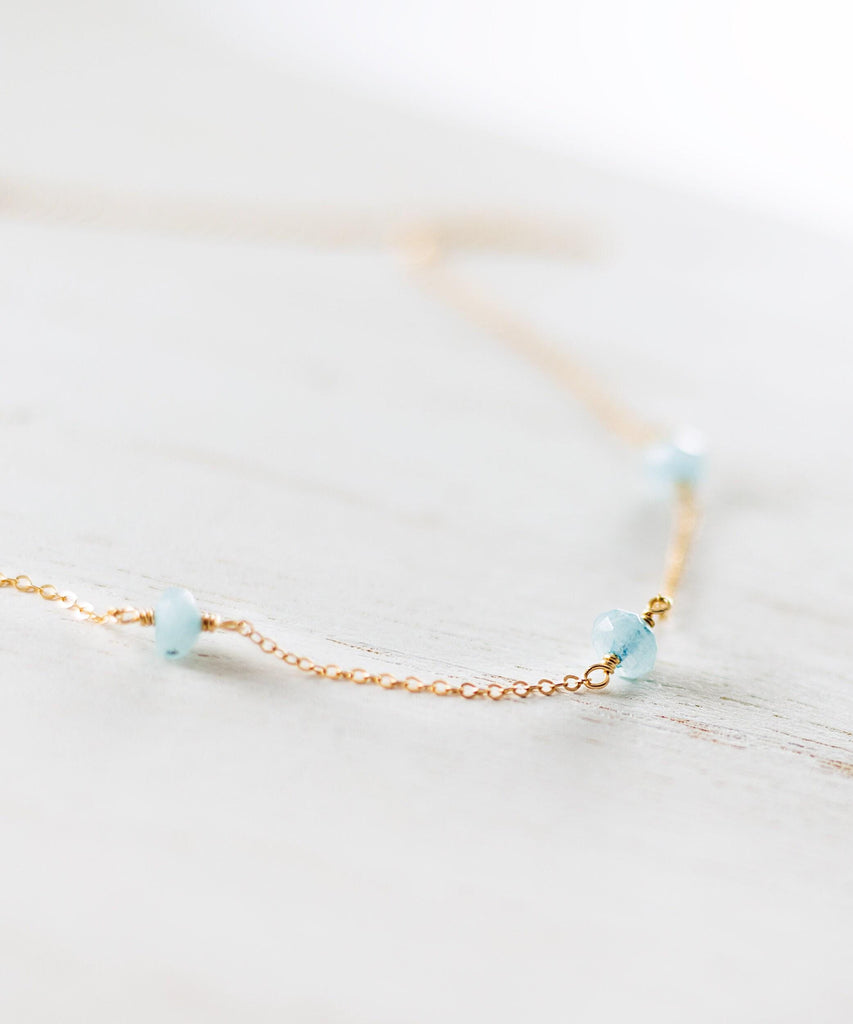 a close up of a necklace on a table