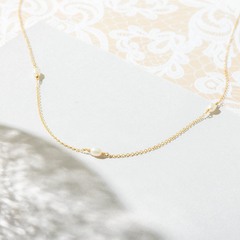 a close up of a necklace on a table