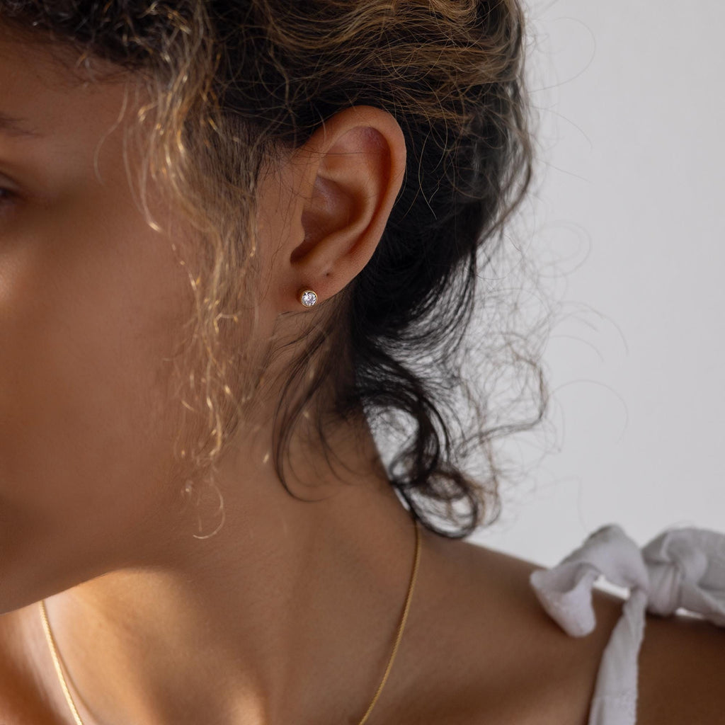 a close up of a person wearing a necklace