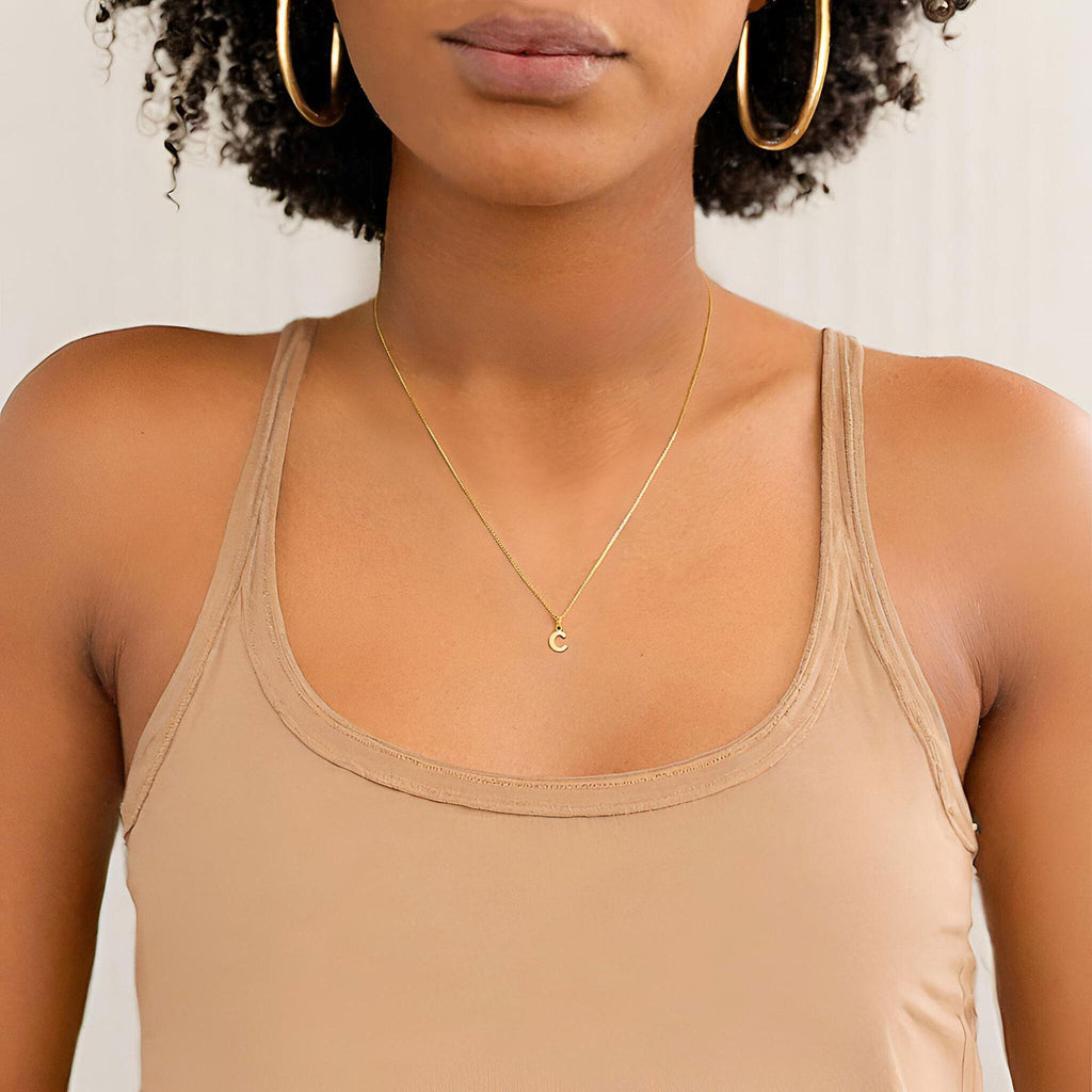 a close up of a person wearing a tank top