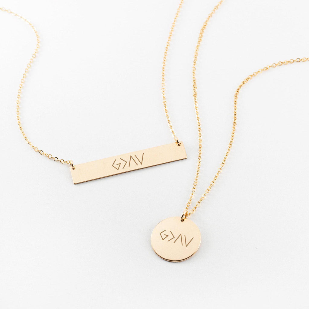 a couple of necklaces sitting on top of a table