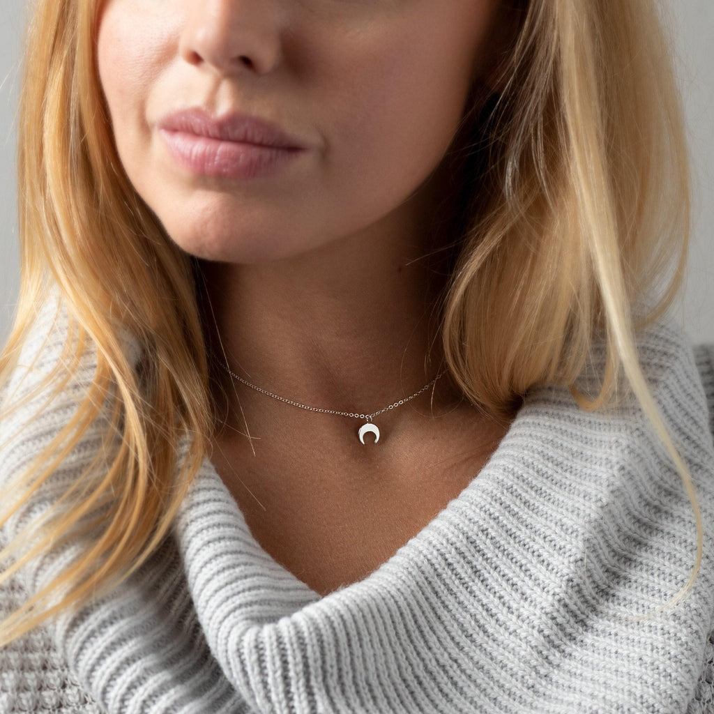 a close up of a person wearing a sweater