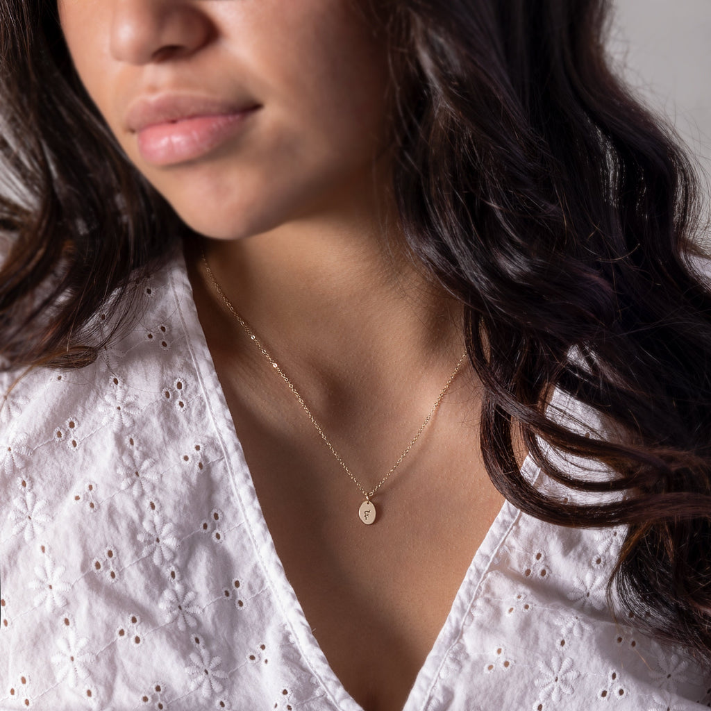 a close up of a person wearing a necklace