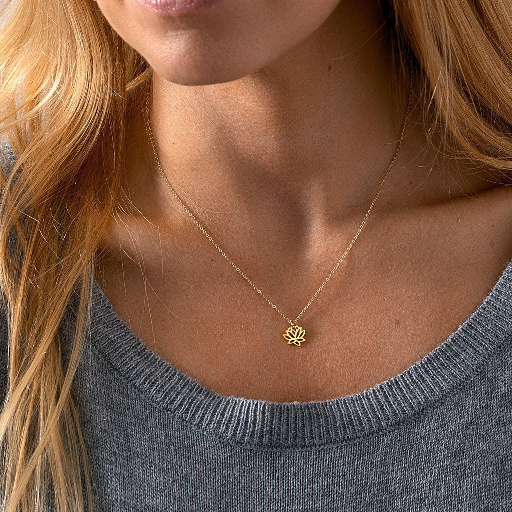 a close up of a person wearing a necklace