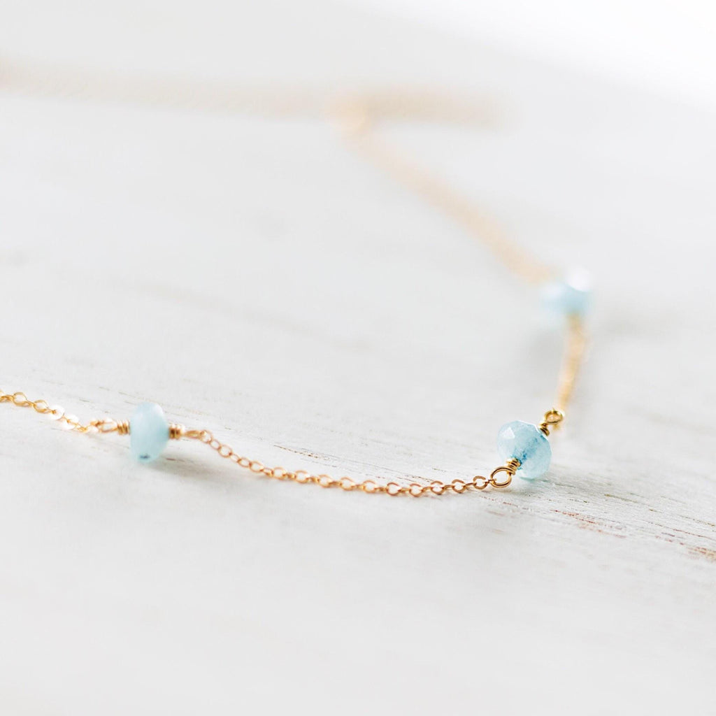 a close up of a necklace on a table
